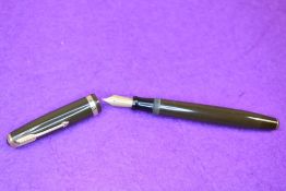 A Parker Duofold NS fountain pen in chocolate brown, with a decorated broad band to the cap. With