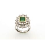 Emerald halo and diamonds ring
