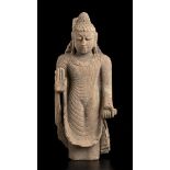 A STONE SCULPTURE OF A STANDING BUDDHA India, 20th century