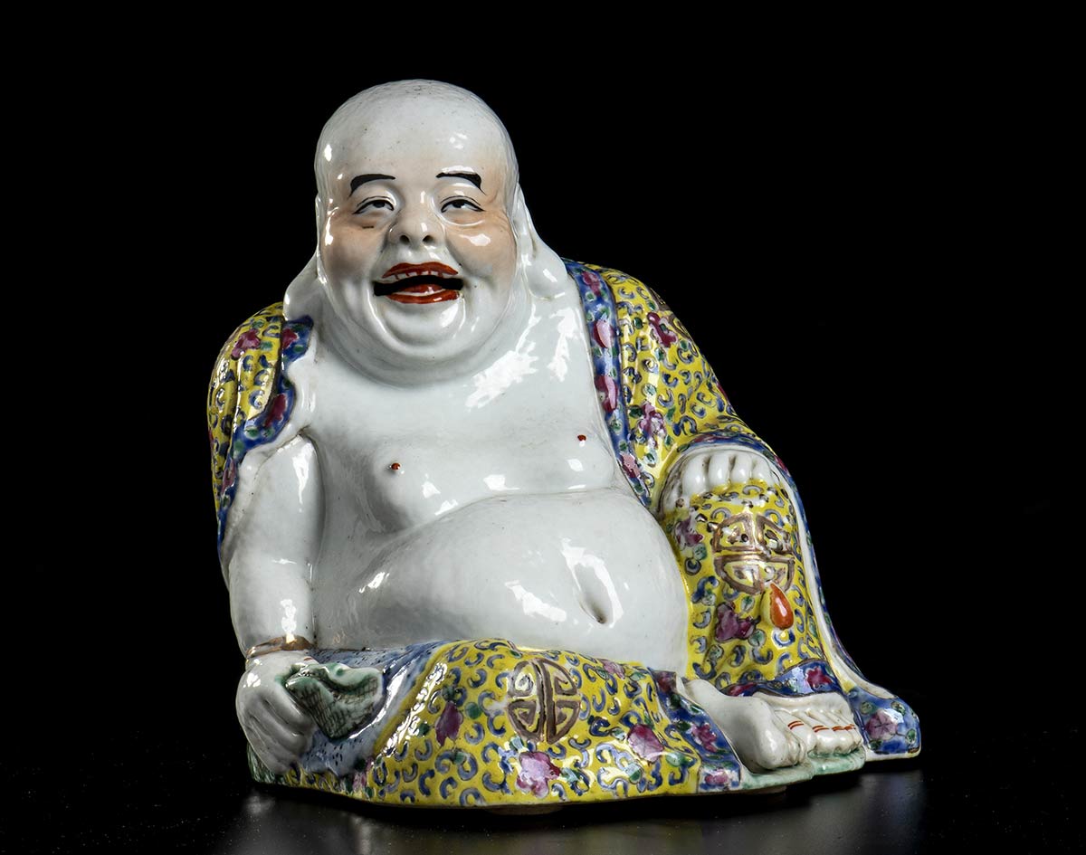 A POLYCHROME PORCELAIN SEATED BUDAI China, 20th century