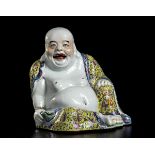 A POLYCHROME PORCELAIN SEATED BUDAI China, 20th century