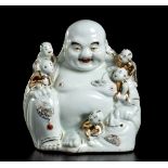 A PARTIALLY GILT PORCELAIN SEATED BUDAI WITH CHILDREN China, 20th century