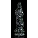 A GREEN STONE STANDING GUANYIN China, 20th century