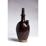 A RUSSET-BROWN-GLAZED CERAMIC WATER SPRINKLER, KUNDIKAChina, Liao dynasty