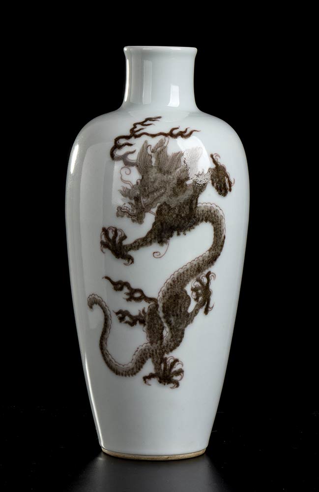 A PORCELAIN BALUSTER VASE WITH COPPER RED 'DRAGONS' DECORATION China, 20th century