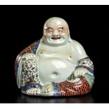 A POLYCHROME PORCELAIN SEATED BUDAI China, 20th century