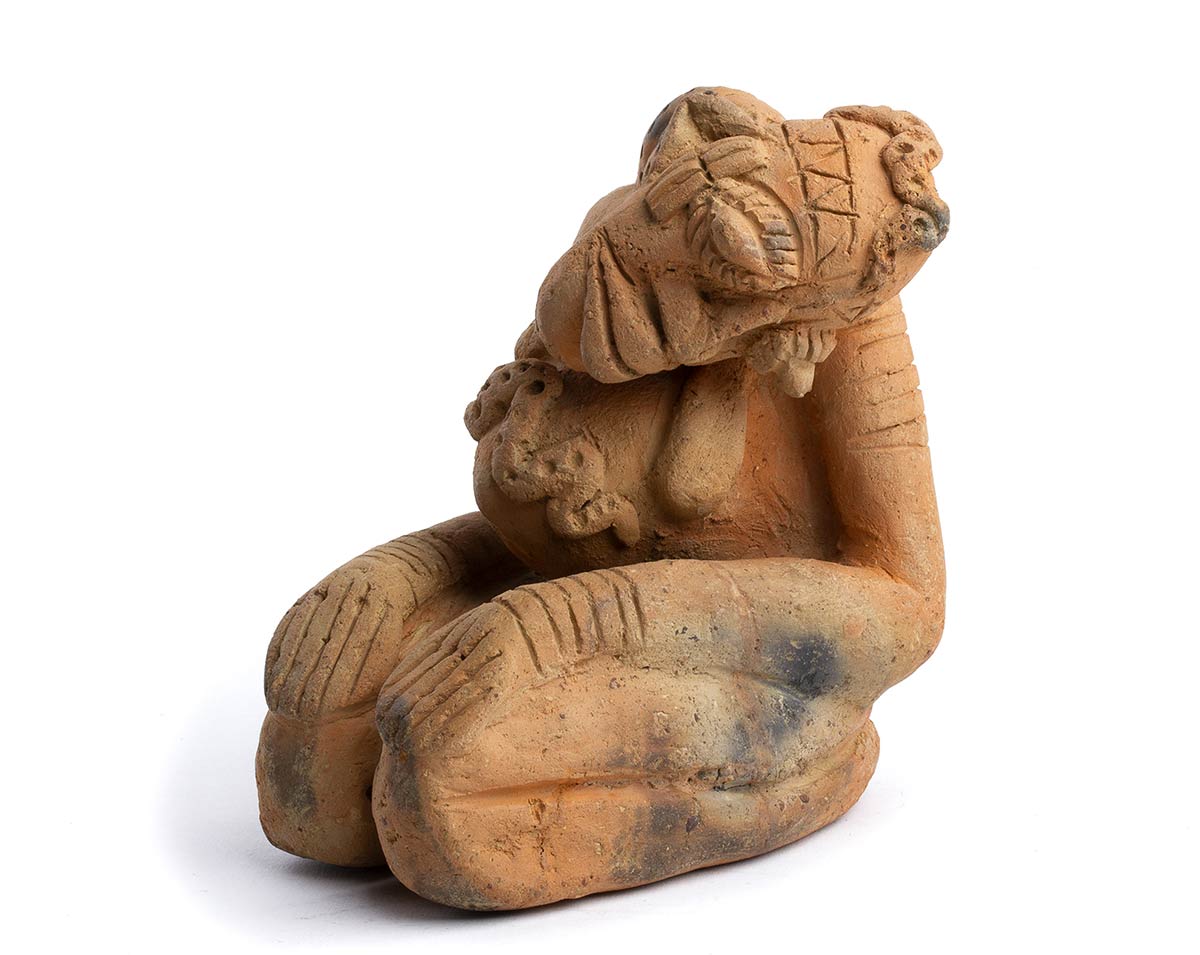 A DJENNÉ TERRACOTTA KNEELING FIGURE Mali