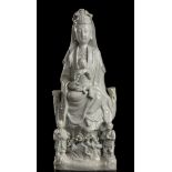 A 'BLANC DE CHINE' PORCELAIN GUANYIN ON THRONE WITH CHILD AND ATTENDANTS China, Kangxi period