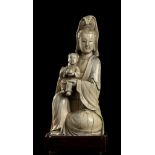 AN IVORY GUANYIN WITH CHILD China, Qing dynasty, 19th century