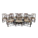 A SET OF TWELVE GEORGE III MAHOGANY DINING CHAIRS, comprising two carvers and ten singles, each with