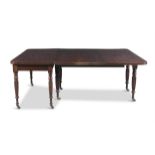 A WILLIAM IV MAHOGANY RECTANGULAR DINING TABLE, with reeded rim and raised on turned lobed