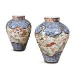 A PAIR OF LARGE JAPANESE ARITA PORCELAIN VASES, c.1900, of ovoid form, with stiff neck collar,