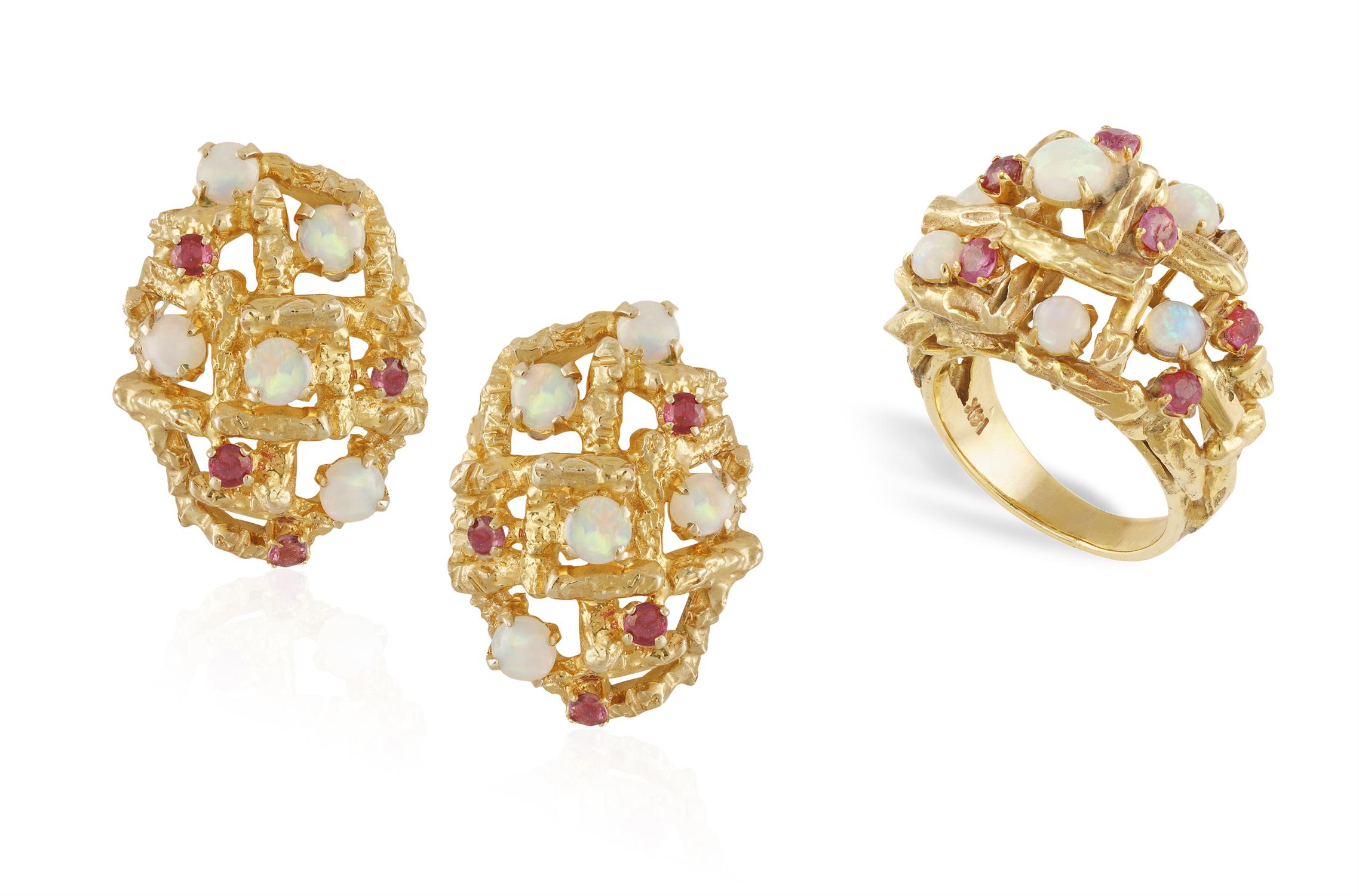 AN OPAL AND RUBY COCKTAIL RING WITH MATCHING EARCLIPS, of openwork bombé design highlighted with