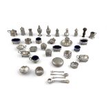 A LARGE COLLECTION OF SILVER CONDIMENTS, napkin rings, etc. various hallmarks and dates