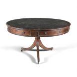 AN IRISH MAHOGANY 19TH CENTURY DRUM TABLE, of circular form, the top inset with tooled leather