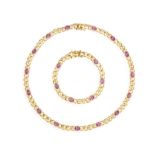 AN AMETHYST AND GOLD NECKLACE WITH BRACELET EN SUITE, both composed of polished gold fancy-links
