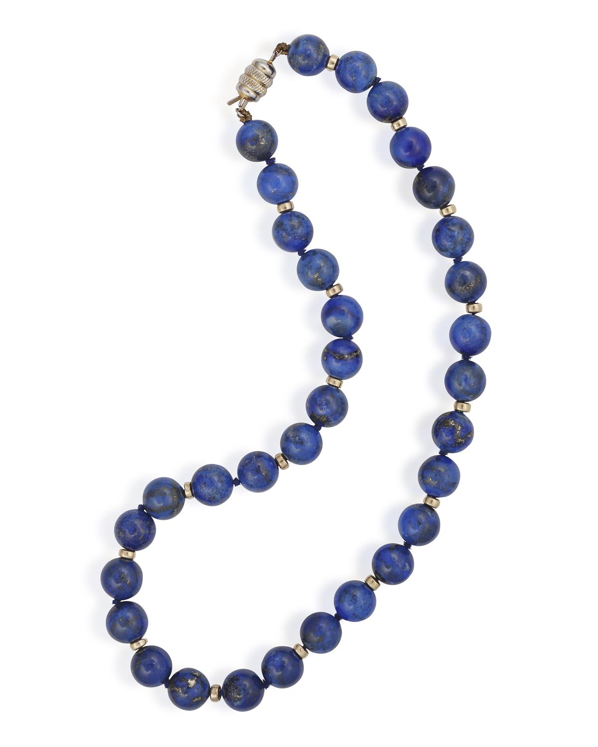 A LAPIS LAZULI BEAD NECKLACE, composed of round-shaped lapis lazuli beads measuring approximately