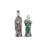 A JAPANESE KUTANI PORCELAIN FIGURE OF DIGNITARY, standing and holding a feather fly whisk, with