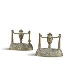 A PAIR OF BRASS CHENETS, in the neo-classical taste, each with central urns and swags, flanked by