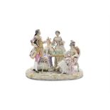 A LATE 19/20TH CENTURY PARIS POLYCHROME PORCELAIN FIGURAL GROUP, depicting three fashionable