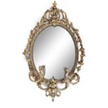 AN EARLY 19TH CENTURY GILTWOOD, PLASTER AND GESSO OVAL GIRANDOLE WALL MIRROR, the beaded frame