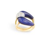 A DIAMOND AND LAPIS LAZULI COCKTAIL RING, composed of a central loop decorated with lapis lazuli and