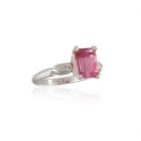 A TOURMALINE AND DIAMOND RING, composed of a rectangular-cut pink tourmaline weighing