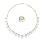 A MOONSTONE NECKLACE TOGETHER WITH A MATCHING RING, composed of graduated round-shaped cabochon
