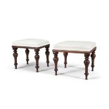 A NEAR PAIR OF MAHOGANY FRAMED UPHOLSTERED STOOLS, mid-19th century, each covered in white fabric,