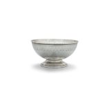 A BRIGHT CUT WHITE METAL CENTRE BOWL, probably American c.1900, of plain hemispherical shape, with