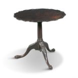A GEORGE III MAHOGANY TILT TOP TEA TABLE, with raised pie crust rim, with fluted central pillar,