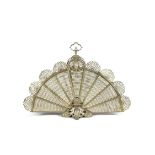 A FRENCH CAST BRASS FAN SPARK GUARD, with female mask decoration, raised on foliate scroll base.
