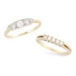 TWO DIAMOND RINGS, the first ring set with a central brilliant-cut diamond between graduated