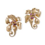A PAIR OF RUBY AND GOLD DOUBLE CLIP BROOCHES CIRCA 1945, each flowerhead with scrolling design and