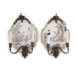 A PAIR OF FRENCH FAIENCE GLAZED WALL SCONCES, Lille, each mounted on a porcelain dish decorated with