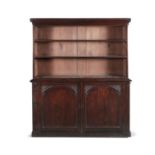 A VICTORIAN MAHOGANY BOOKCASE, of rectangular form, the open upper section with outset moulded