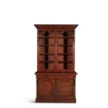 A VICTORIAN TWO DOOR MAHOGANY BOOKCASE, with moulded cornice above twin glazed doors, flanked by