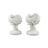 A PAIR OF BELLEEK NAUTILUS SHELL VASES, 1st period (1893-1890), supported on coral stalks and