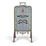 AN ART NOUVEAU BRASS FRAMED STAINED GLASS FIRE SCREEN. 122cm high