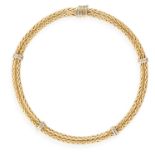 A GOLD NECKLACE, composed of two textured gold fancy-link chains joined with polished gold links, in