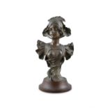 HENRI JACOBS (1864-1935) Portrait bust of a girl in a bonnet Spelter, on a circular socle base, 52cm