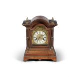 A LATE 19TH / EARLY 20TH CENTURY CONTINENTAL BRACKET CLOCK, of arched rectangular form,