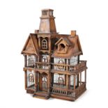 AN UNUSUAL CARVED AND STAINED WOOD BIRDCAGE, modelled as a two-storey house with arched window door