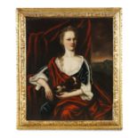ENGLISH SCHOOL (18TH CENTURY) Portrait of a lady seated, holding a spaniel, with distant