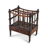 A VICTORIAN MAHOGANY RECTANGULAR CANTERBURY, with three open compartments, raised on turned columns,