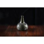 A LATE 17TH/EARLY 18TH CENTURY 'GLASS ONION'/ ONION WINE BOTTLE, of squat onion form and tapered