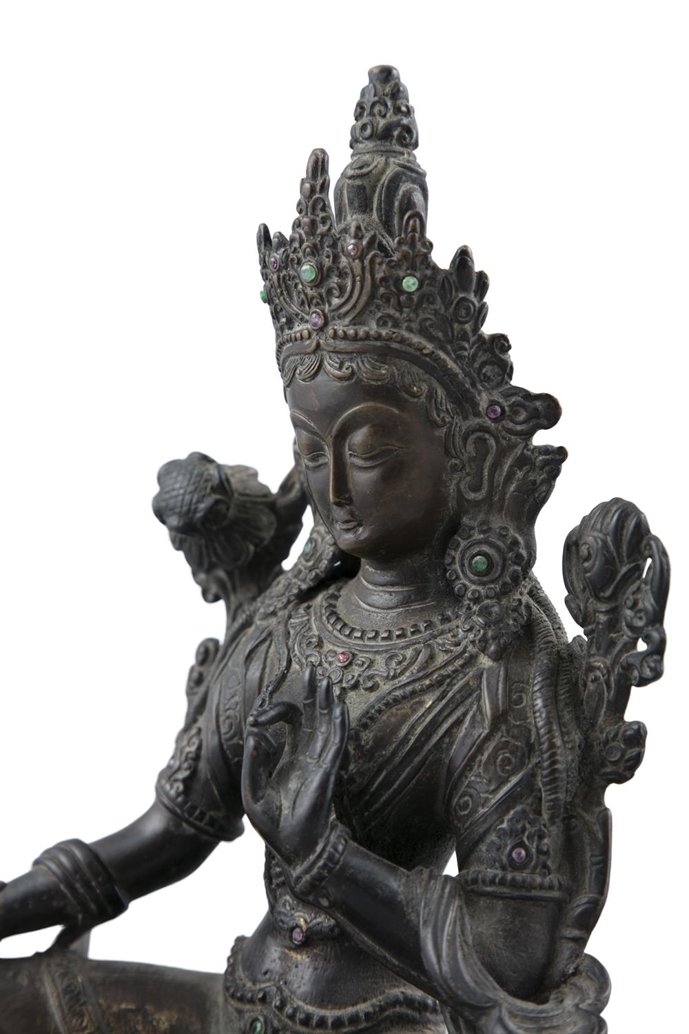 A CHINESE BRONZE FIGURE OF A SEATED GUANYIN, Qing Dynasty, in meditative pose, with raised left - Image 3 of 4