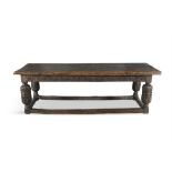 A 17TH CENTURY WILLIAM AND MARY OAK AND ELM REFECTORY TABLE, the plank top in figured elm,
