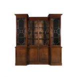 A 19TH CENTURY MAHOGANY BREAKFRONT BOOKCASE, with moulded cornice above four astragal glazed panel
