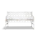 A WHITE PAINTED CAST IRON THREE SEATER GARDEN SEAT, in the traditional gothic pattern. 145cm long